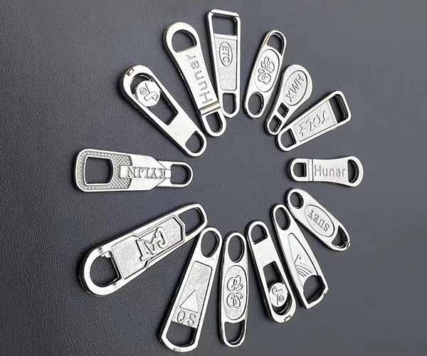 9. zipper puller & hardware logos (2)